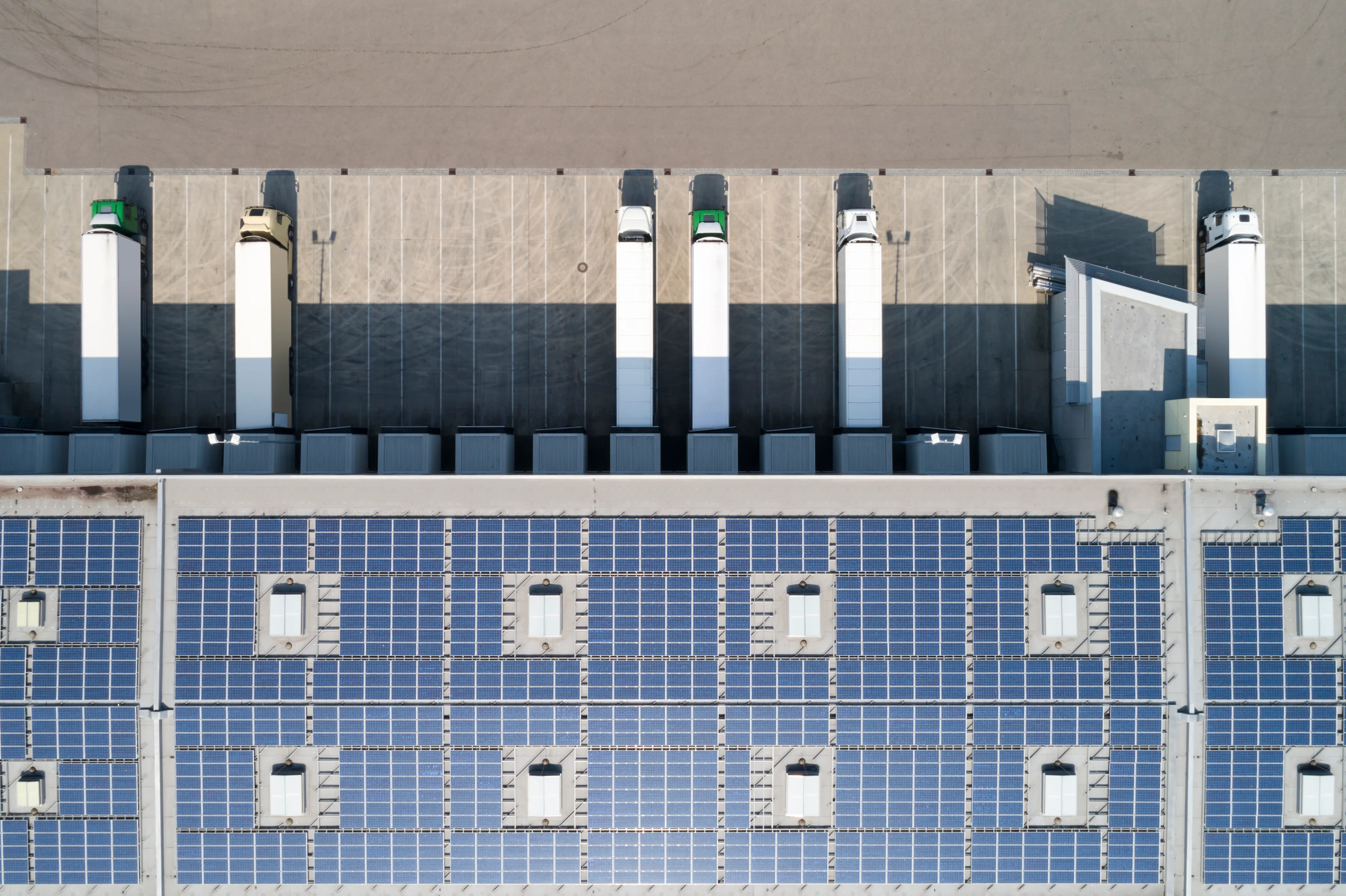 trucks parked under solar pannels