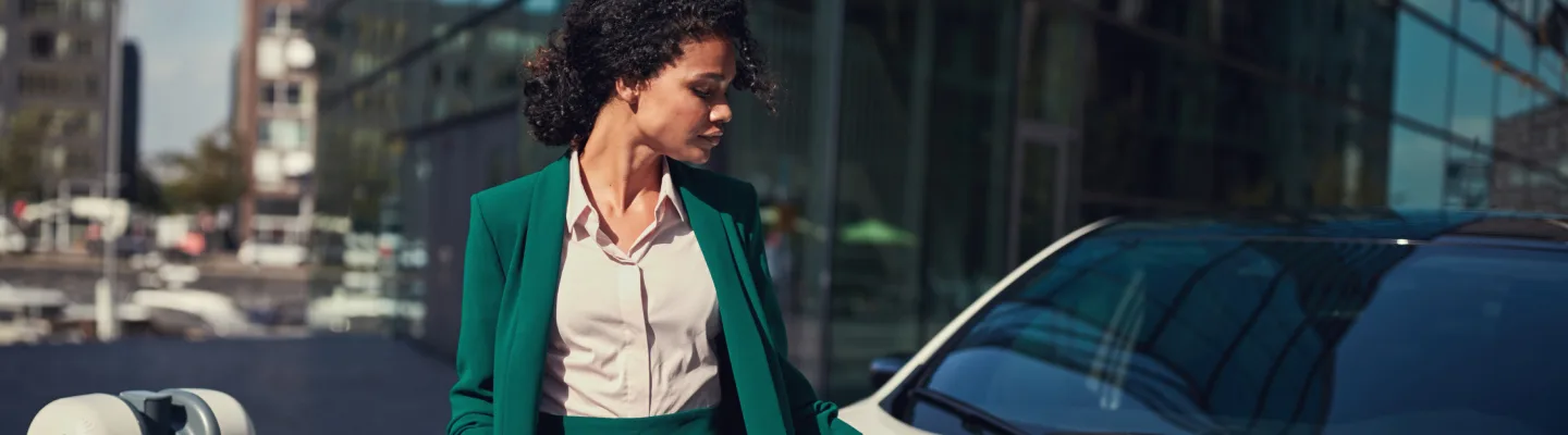 Business woman charging her vehicle